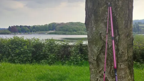 Derbyshire Police Rod leaned up on tree at reservoir