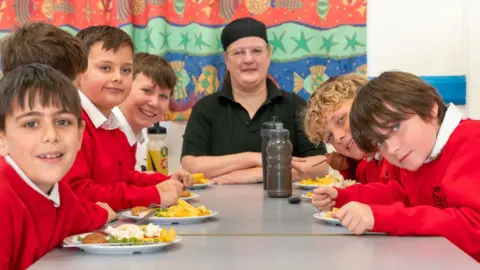 Lena O'Shea A chef with pupils of Southwold Primary School