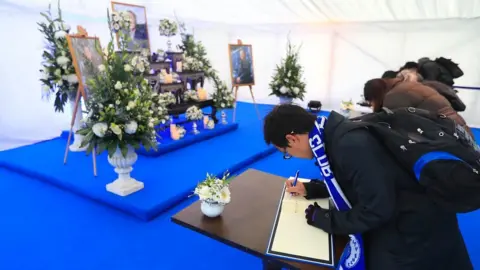 PA Book of condolence being signed