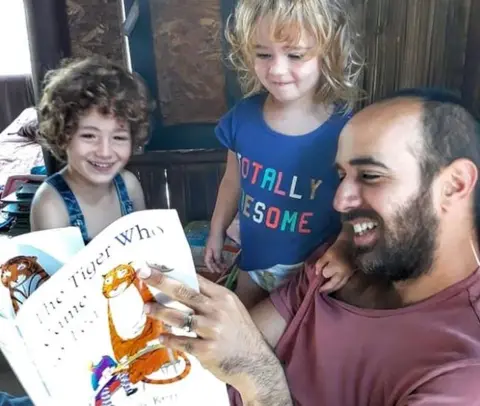 Natasha Biran Yair reading to kids