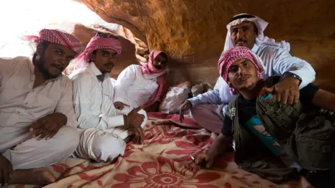 Nour el Din Sherif Tribesmen of the Muzeina and Alegat tribes sit in a cave