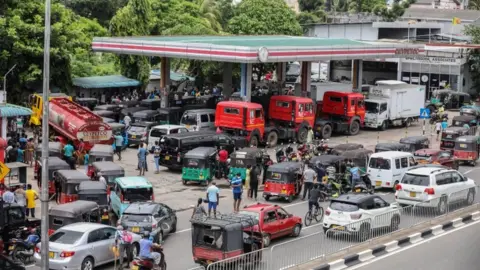 Reuters Vehicles queue at a petrol station in Colombo, Sri Lanka on Monday.