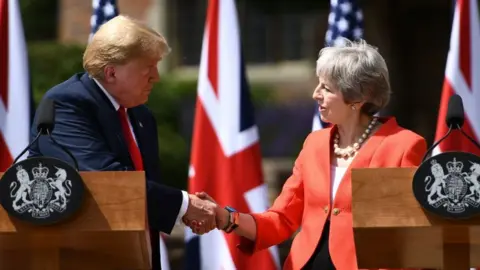 BRENDAN SMIALOWSKI US President Donald Trump and UK Prime Minister Theresa May