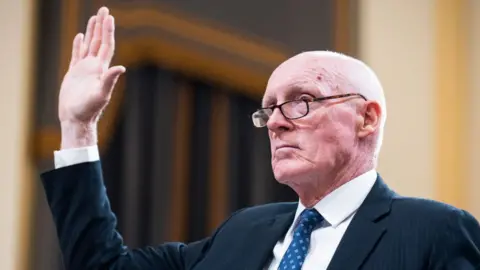 Getty Images Man being sworn in