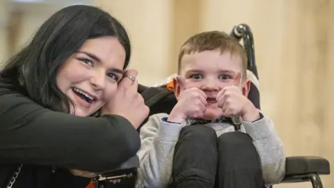 PA Media Dáithí Mac Gabhann with his mum Seph