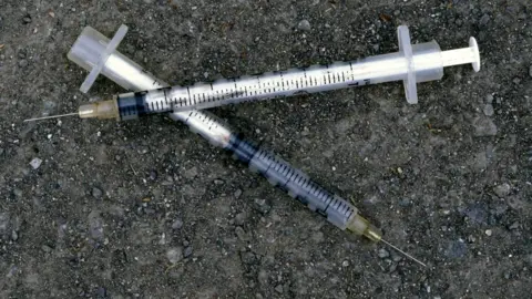 Getty Images Discarded syringes