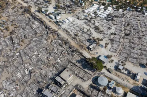 EPA A drone photo on 14 September showing Moria camp ruins