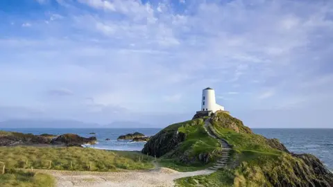 Getty Images Steps up to the old lighthouse on Llanddwyn Island, off Anglesey