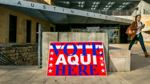 Getty Images Sign reads: Vote Aqui Here