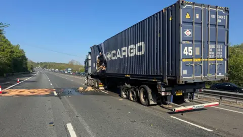 TVP Roads Policing Another view of the wine truck. Some sand is on the carriageway in this image, presumably to soak up the spill.