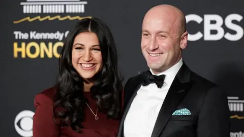 Reuters Katie and Stephen Miller pose during a red-carpet event