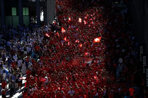 Reuters A crowd of Switzerland fans fill the streets of Geneva