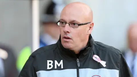 Former Reading manager Brian McDermott looks on from the touchline during a Reading match