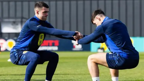 Lennon Miller (left) at Scotland training