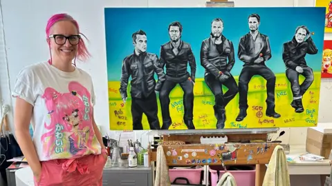 Sarah Graham Sarah Graham with her painting of Take That from 2012