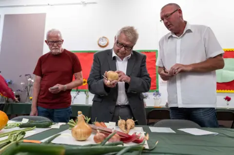 Jim Grover Ricky Hoskin judging the vegetables