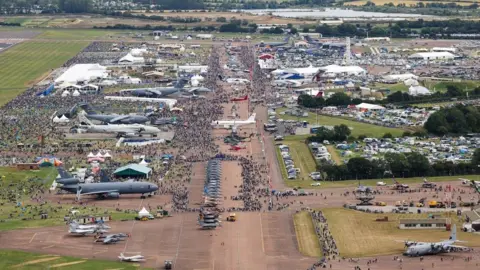 Royal Air Force Charitable Trust Overhead shot of the airfield packed full of visitors and planes