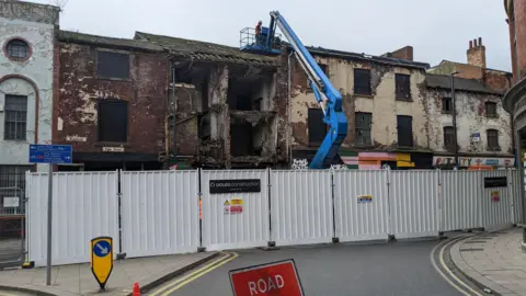 BBC Contractors start work on stabilising the former shop on Kirkgate, in Leeds 