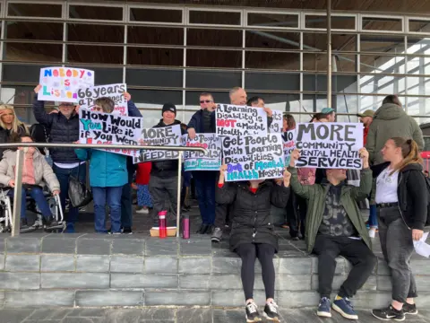 About 150 people attended a protest outside the Senedd