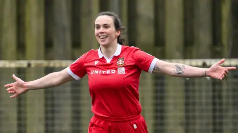 Rosie Hughes celebrates after scoring Wrexham's fifth against Swansea City