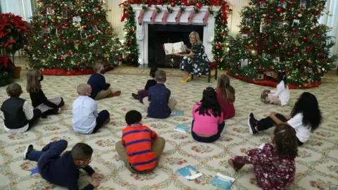 Getty Images Mrs Biden was unmasked while reading to school pupils at the White House