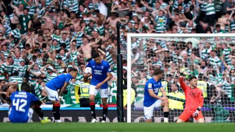 Celtic fans celebrate scoring against Rangers