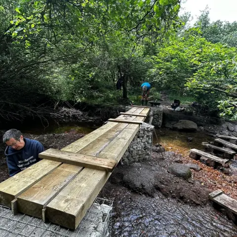 Peak Park Conservation Volunteers Sleepers placed over a babbling brook