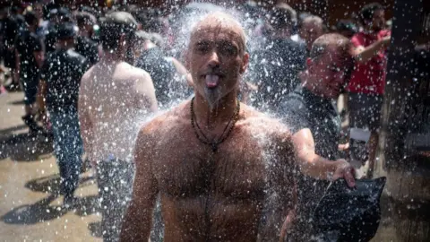 Getty Images Image shows man cooling off