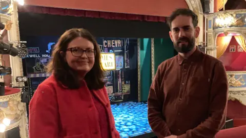 Novae Baghurst on the left and Graham McKnight on the right standing on the balcony in Crewe's Lyceum Theatre