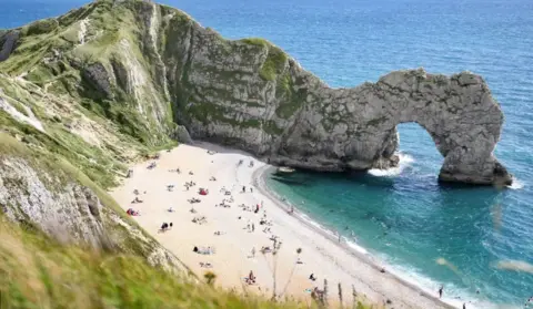 View of the beach and rock arch formations at Durdle Door