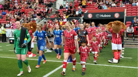Getty Images Players from Everton and Bristol City walk out at Ashton Gate for a Barclays WSL match