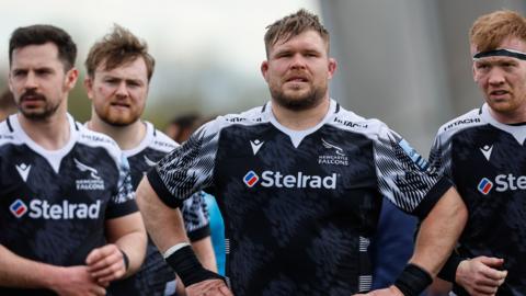 Newcastle Falcons players look disappointed after a defeat