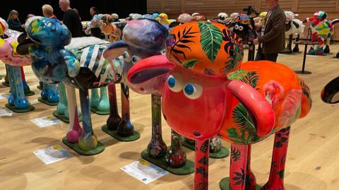Statues of Shaun the Sheep ready to be auctioned