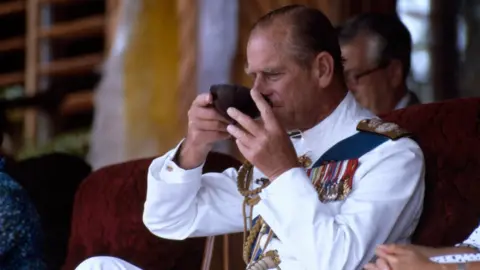 Getty Images Prince Harry's grandfather, the Duke of Edinburgh, trying Kava during a visit to Fiji in 1982