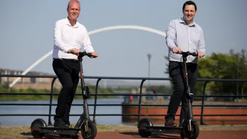 Tees Valley Combined Authority Paul Hodgins and Ben Houchen on scooters