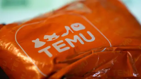 Getty Images An orange Temu package.