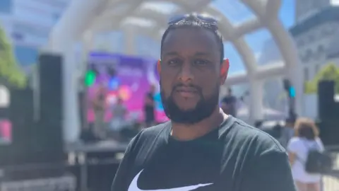 Jenny Kirk/BBC Musthafa Hussain at a festival