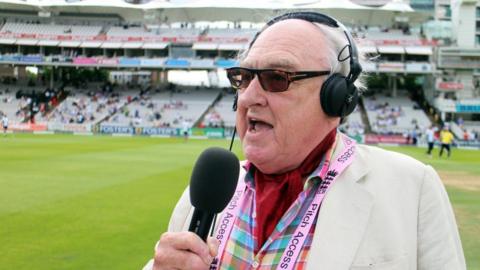 Henry Blofeld commentating on cricket match