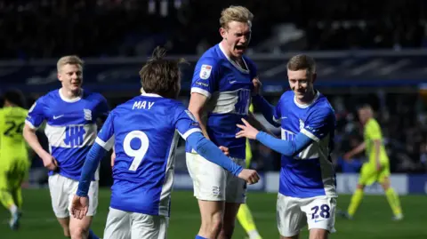 Birmingham players celebrate scoring a goal against Rotherham United