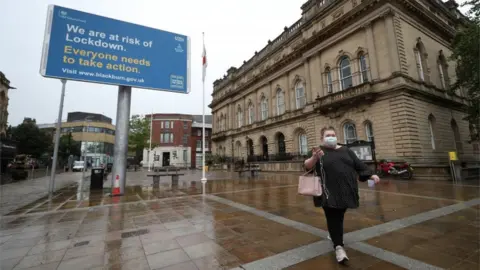 PA Media Coronavirus advisory notice on a billboard outside Blackburn Town Hall