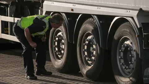 Getty Images UK Border Force officer checking a lorry