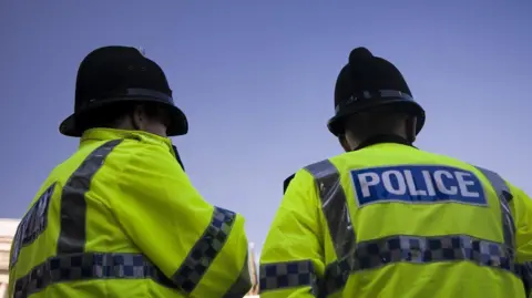 Getty Images Police facing away from the camera