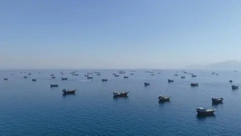 A drone view of vessels in the Strait of Hormuz, seen from Oman