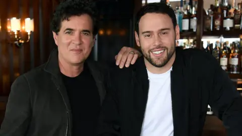 Getty Images Scott Borchetta (left) and Scooter Braun
