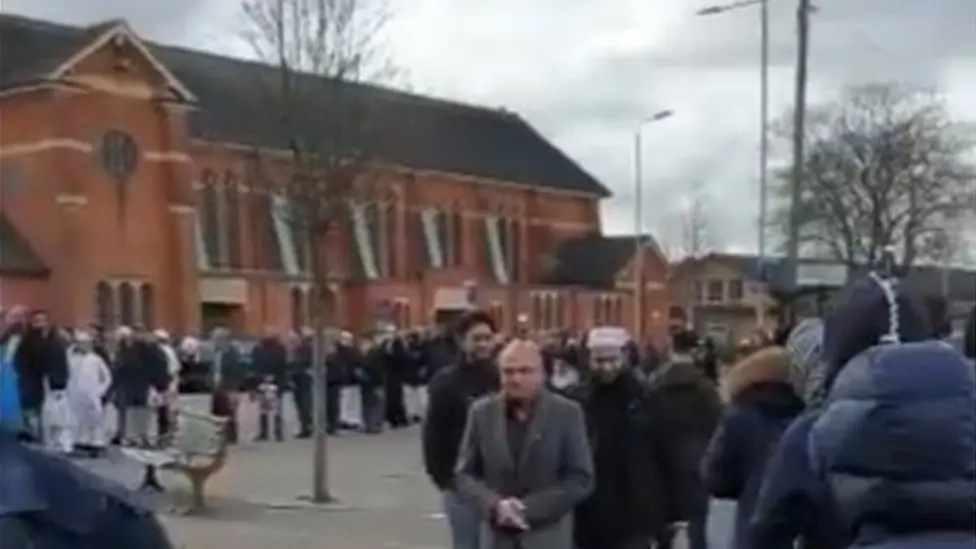 BBC Worshippers outside a Leicester mosque