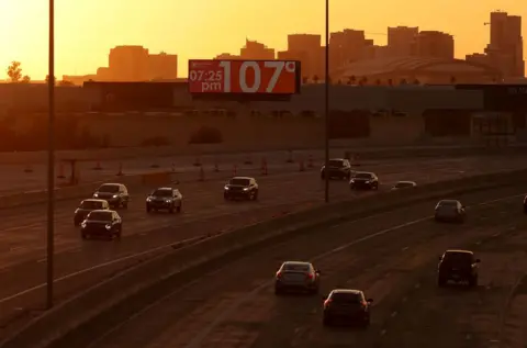 getty US motorway at dusk with temperature sign showing 107F