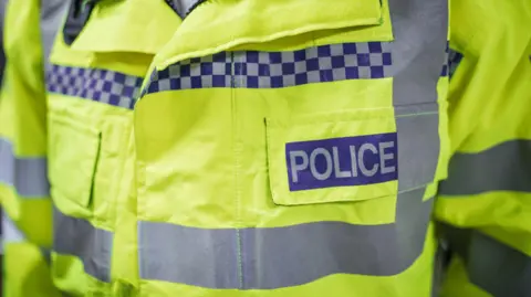 Getty Images Close up of a police jacket.