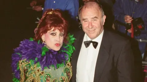 Getty Images Margarita Pracatan with Clive James in 1995