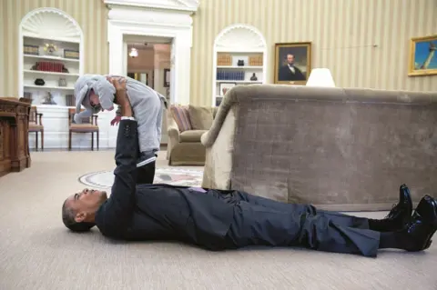 Pete Souza Obama and a child