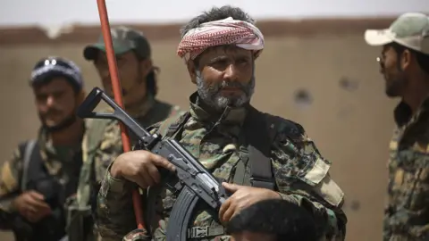 AFP Syrian Democratic Forces (SDF) fighters in the village of Hazima, Syria (6 June 2017)